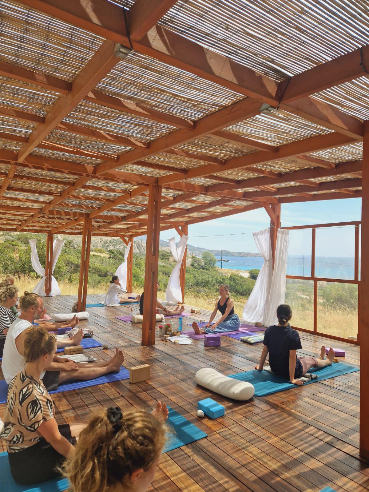 A group yoga class in a village hall