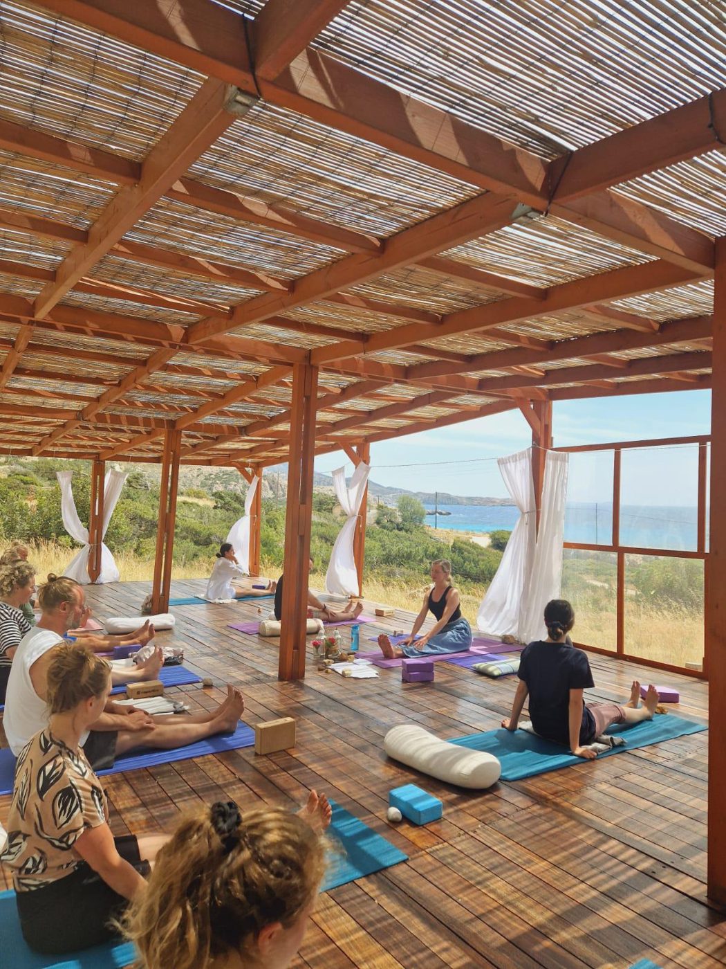 Tallulah teaching a group at an open-air retreat